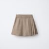 Jupe fille en lin naturel beige avec plis plats, taille enfant, look épuré pour été