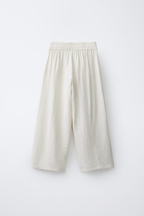 Pantalon lin beige fille taille élastique vue dos, tissu naturel léger pour enfant