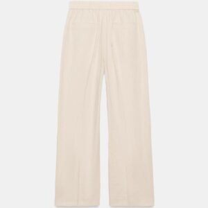 Pantalon en lin beige femme vue de dos, taille élastiquée et poches plaquées, coupe droite légère