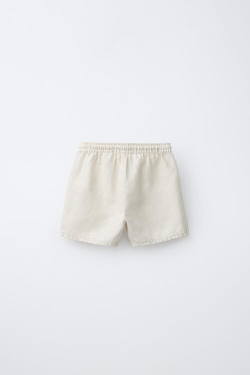 Short fille en coton bio blanc dos, taille enfant, ceinture élastiquée, coupe décontractée