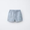 Short garçon en laine gris clair, taille enfant, poches avant et cordon de serrage