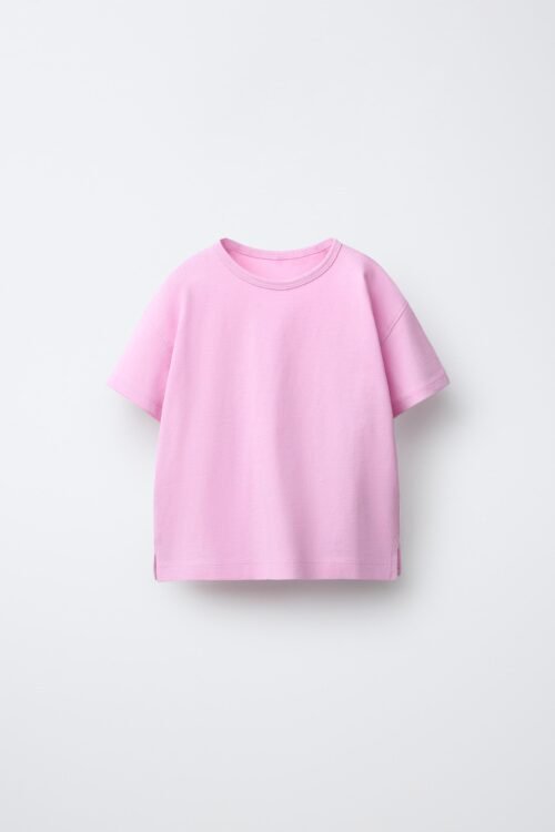 T-shirt fille coton bio rose tendre uni, manches courtes, taille enfant, présenté à plat